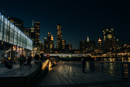view of the Brooklyn bridge from pier 17 at night. New York, USA - May 12th 2023. High quality photoのeditorial素材
