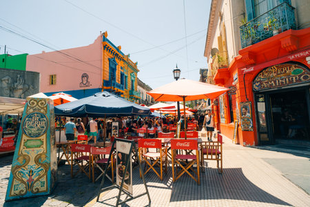 Typical brightly colored building on Caminito in La Boca witn tourists, Buenos Aires, Argentina - Dec 2th 2023. High quality photoのeditorial素材