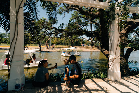 Buenos Aires Argentina - Dec 26th 2023 People enjoy floating by boat at Palermo Park Lake. High quality photoのeditorial素材