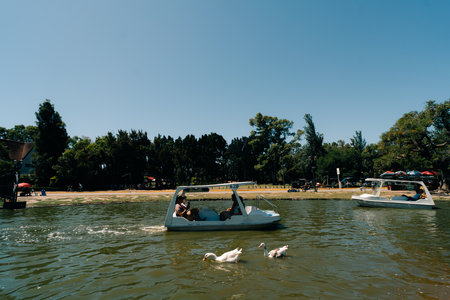 Buenos Aires Argentina - Dec 26th 2023 People enjoy floating by boat at Palermo Park Lake. High quality photoのeditorial素材