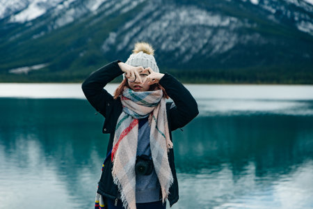 girl standing with her back to the viewer among the mountains Banff, Canada. High quality photoの写真素材