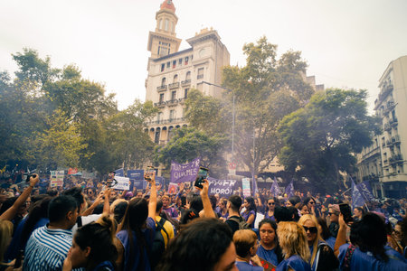 Women chant slogans during the Ni Una Menos march for International Women's Day, outside the Argentine Congress in Buenos Aires, argentina - March 8, 2024. High quality photoのeditorial素材