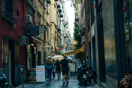 Narrow streets with restaurants in Naples, Italy - may 2 2024. High quality photoのeditorial素材