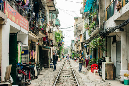 Hanoi, Vietnam - 24 May 2024 Tourists taking pictures of hurtling train. The Hanoi Train Street....