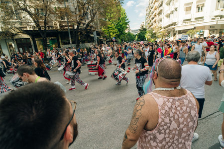 greece, Thessaloniki - may 2 2024 Music band playing drums in street marching parade at public event. High quality photoのeditorial素材