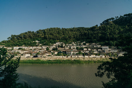 BERAT, ALBANIA, April 13, 2024: Berat castle viewed from boulevard Republika in Albania. High...