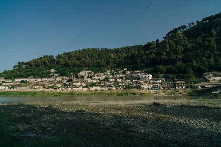 BERAT, ALBANIA, April 13, 2024: Berat castle viewed from boulevard Republika in Albania. High...