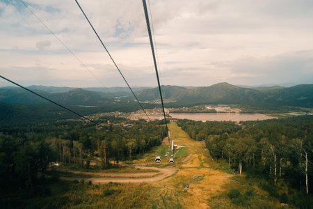 Manzherok resort, Russia. Close-up of a cable car cabin against the sky. Cable car trip to viewpoints in the mountains. . High quality photoの写真素材