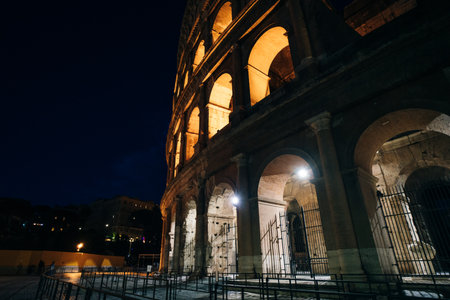 Colosseum is one of the main travel attraction of Rome at night, Italy. Panorama of Ancient Roman ruins, Italy - May 2, 2024. High quality photoの写真素材
