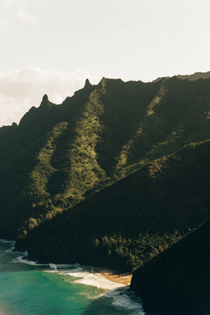 Hawaii Kauai Na Pali coast landscape aerial view from helicopter. Nature coastline dramatic mountains with secluded popular tourist attraction beach. USA destination. High quality photoの写真素材