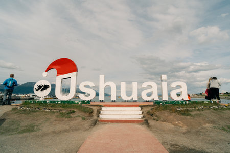 Ushuaia, Province of Tierra del Fuego, Argentina - January 2th, 2024 Many people are at the Ushuaia tourist sign. High quality photoの写真素材
