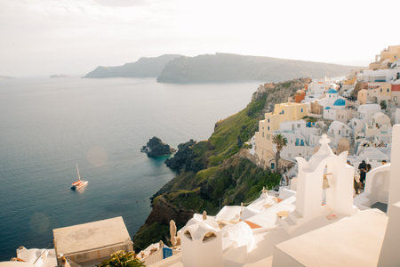 Fira town by the sea on mountain coast of Santorini island in Greece - May 2, 2024. High quality photoの写真素材