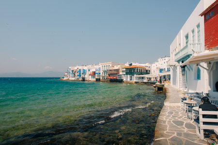Little Venice in Mykonos Island with cafe tables in the foreground, Cyclades, Greece. High quality photoの写真素材