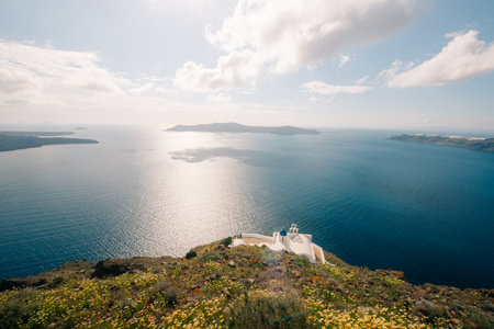 Skaros Rock at Imerovigli village with volcanic island Nea Kameni in background, Santorini, Greece. High quality photoの写真素材