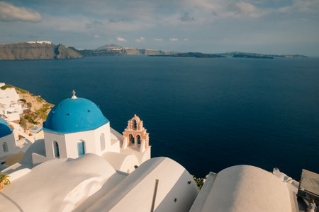 Fira town by the sea on mountain coast of Santorini island in Greece - May 2, 2024. High quality photoの写真素材