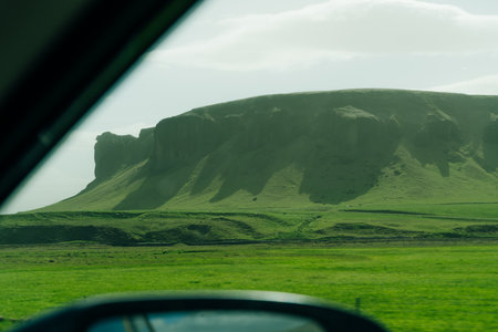 Panorama of Icelandic highland landscape: black volcanic mountains covered with soft green moss. High quality photoの写真素材