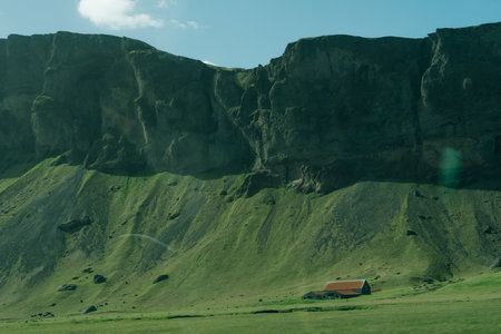 Epic panorama of Icelandic highland landscape: black volcanic mountains covered with soft green moss. High quality photoの写真素材