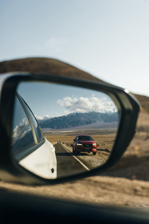 Look in the rear view mirror of a car. High quality photoの写真素材
