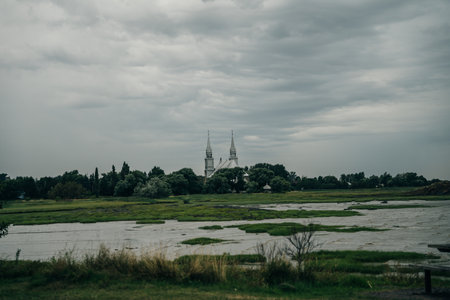 After a rainy day, fiery sunset over the St Lawrence river at the Pointe au Pere Lighthouse in Rimouski, Quebec. High quality photoの写真素材