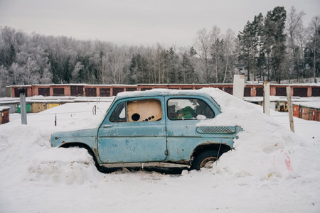 abandoned old car in the snow. High quality photoの写真素材