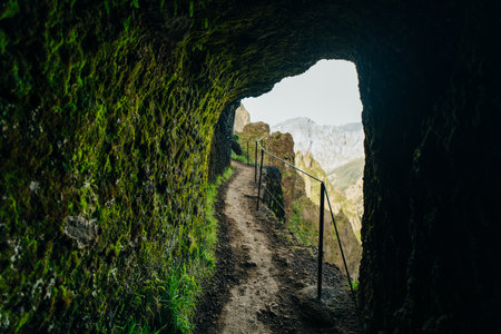 Iconic hike Pico do Areeiro to Pico Ruivo majestic landscape above the clouds panorama with...