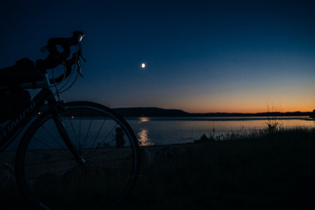 Deserted Sand shoreline of Deer Lake in Newfoundland under blue sky filled with fluffy white clouds in autumn. High quality photoの写真素材