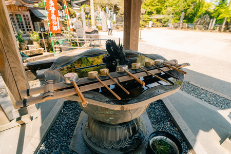 shikoku, JAPAN - May 2, 2025 Okubo Temple No.88. Ladles in the temple for cleaning hands. High...