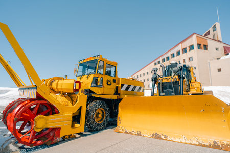 snow removal bulldozer , Snow Wall in Tateyama, Nakaniikawa, Toyama, Japan . High quality photoの写真素材