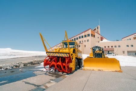 snow removal bulldozer , Snow Wall in Tateyama, Nakaniikawa, Toyama, Japan . High quality photoの写真素材
