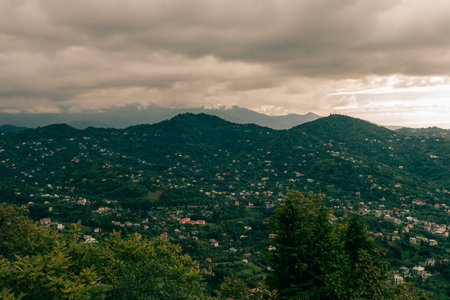 travel to Georgia - green trees and view of Batumi city with suburb from Sameba hill on autumn day. High quality photoの写真素材