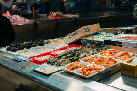 Valencia, Spain 04 07 2025 Interior of Mercado Central in Valencia bustling with people shopping for fresh produce. High quality photoの写真素材