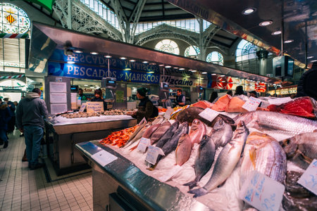 Valencia, Spain 04 07 2025 Interior of Mercado Central in Valencia bustling with people shopping for fresh produce. High quality photoのeditorial素材