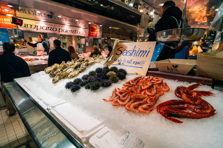 Valencia, Spain 04 07 2025 Interior of Mercado Central in Valencia bustling with people shopping for fresh produce. High quality photoの写真素材