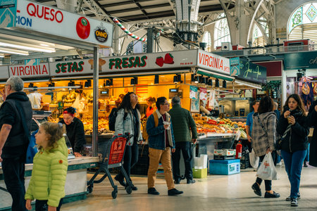 Valencia, Spain 04 07 2025 Interior of Mercado Central in Valencia bustling with people shopping for fresh produce. High quality photoのeditorial素材