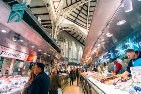 Valencia, Spain 04 07 2025 Interior of Mercado Central in Valencia bustling with people shopping for fresh produce. High quality photoの写真素材