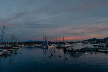 Geneva, Switzerland - Sep 1 2025 luxurious and expensive yachts are docked in a harbor on lake...