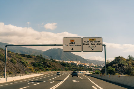marking different lanes, on the dark asphalt floor of a highway. Tenerife, Canary Islands, Spain. High quality photoのeditorial素材