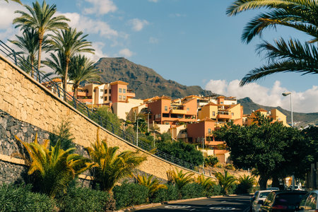 View of palm trees, and beautiful buildings of Spanish architecture, in La Caleta, Tenerife, Spain - 3 Dec 2025. High quality photoの写真素材