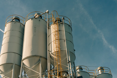 Construction industry concrete plant and equipment.Commercial concrete mixing plant of a cement factory. Concrete mixing silo,Industry manufacturing conceptの写真素材