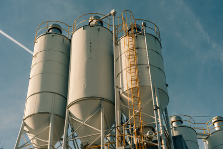 Construction industry concrete plant and equipment.Commercial concrete mixing plant of a cement factory. Concrete mixing silo,Industry manufacturing conceptの写真素材