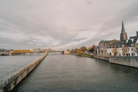 Panorama of Waterfront on the Meuse Maas river with a focus on the Sint Martniuskerk, Maastricht Netherlands - 2 Oct 2025. High quality photoの写真素材