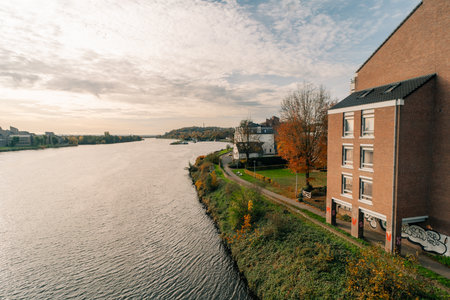 Panorama of Waterfront on the Meuse Maas river with a focus on the Sint Martniuskerk, Maastricht Netherlands - 2 Oct 2025. High quality photoの写真素材