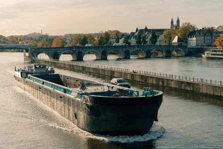 Panorama of Waterfront on the Meuse Maas river with a focus on the Sint Martniuskerk, Maastricht Netherlands - 2 Oct 2025. High quality photoの写真素材