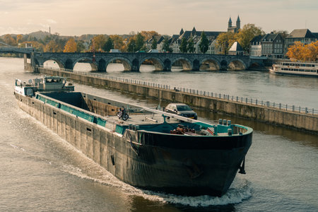 Panorama of Waterfront on the Meuse Maas river with a focus on the Sint Martinuskerk, Maastricht Netherlands - 2 Oct 2025. High quality photoの写真素材