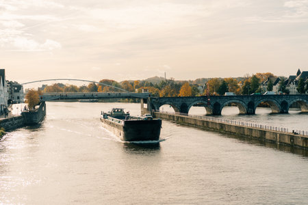 Panorama of Waterfront on the Meuse Maas river with a focus on the Sint Martniuskerk, Maastricht Netherlands - 2 Oct 2025. High quality photoの写真素材