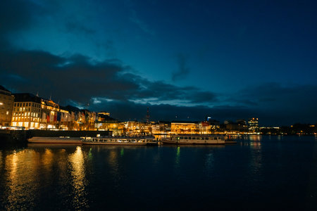 Hamburg city center view at night in Germany. Swans on the water. High quality photoの写真素材