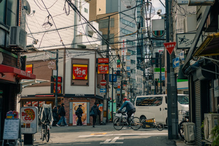 Osaka, Japan - November 5, 2025 Vibrant signs line a side street in central Osaka . High quality...