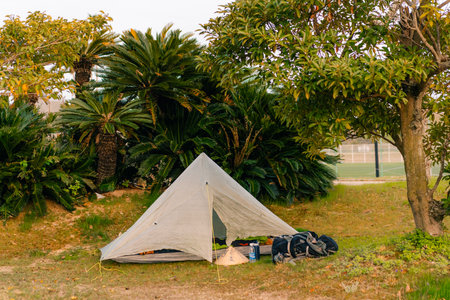 shikoku, japan - August 3, 2025 tourist bivouac with a single-seater ultra-light tent. High quality...