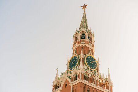 Moscow Kremlin on Red Square. Spasskaya Savior's clock tower timelapse hyperlapse decorated by the red ruby star on the top of it. Close up view. Blue sky background. UNESCO World Heritage Siteの写真素材