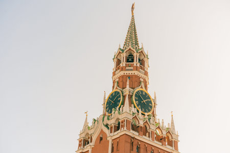 Moscow Kremlin on Red Square. Spasskaya Savior's clock tower timelapse hyperlapse decorated by the red ruby star on the top of it. Close up view. Blue sky background. UNESCO World Heritage Siteの写真素材